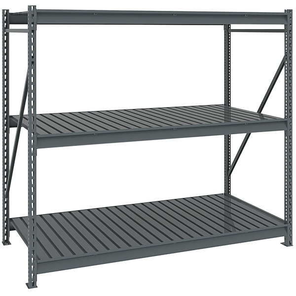 A dark grey Tennsco boltless shelving unit with corrugated decking.
