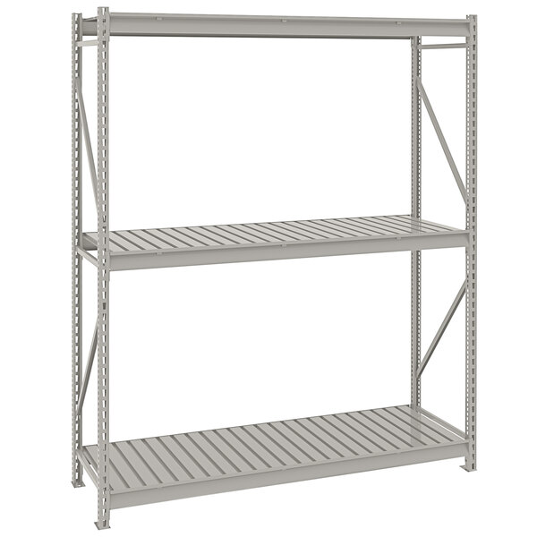 A gray metal Tennsco boltless shelving unit with three shelves.