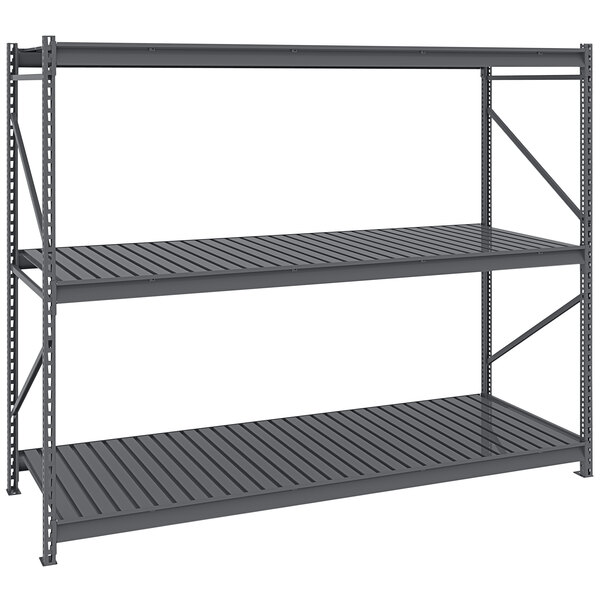 A dark grey Tennsco boltless shelving unit with corrugated decking.