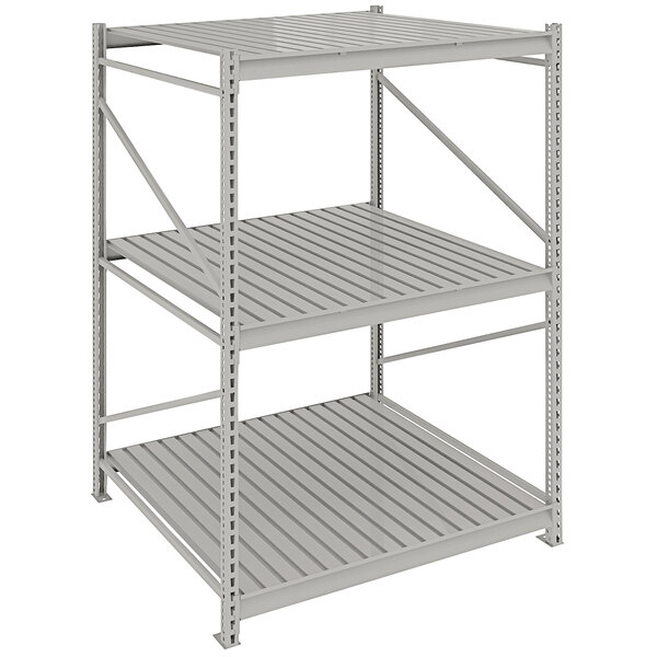 A light gray metal Tennsco boltless shelving unit with corrugated decking.