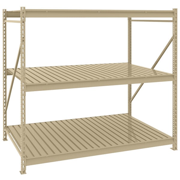 A beige Tennsco boltless shelving unit with corrugated decking on two shelves.