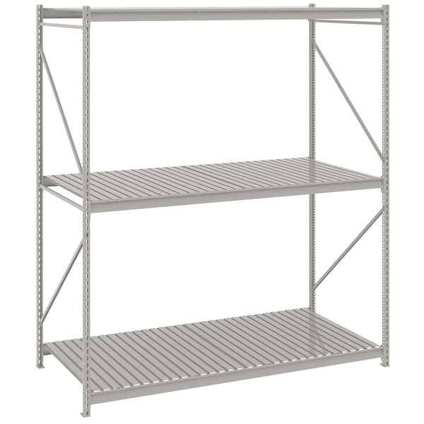 A light gray metal Tennsco bulk shelving unit with corrugated decking.