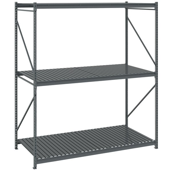A dark gray metal Tennsco bulk storage rack unit with corrugated decking.