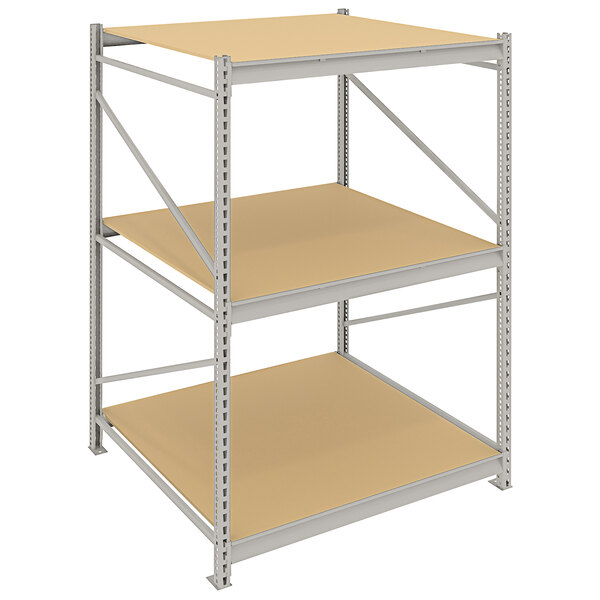 A Tennsco metal boltless shelving unit with three shelves and particleboard decking.