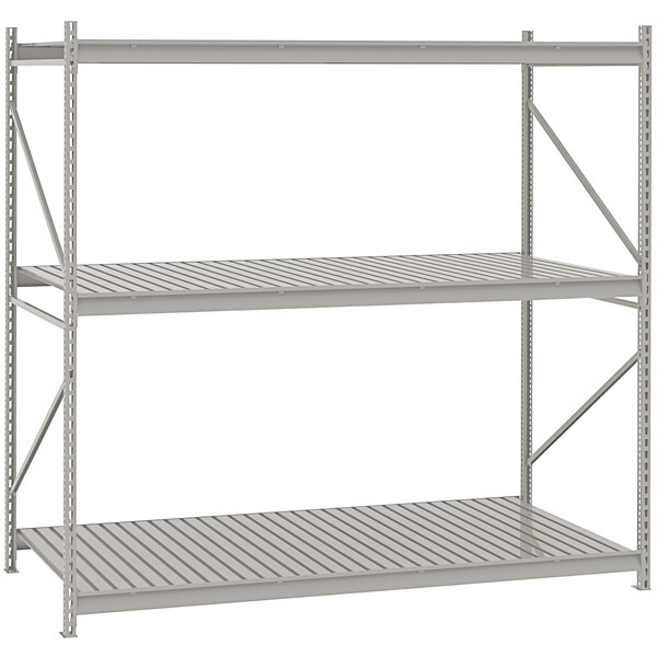 A light gray metal Tennsco bulk shelving unit with corrugated decking.