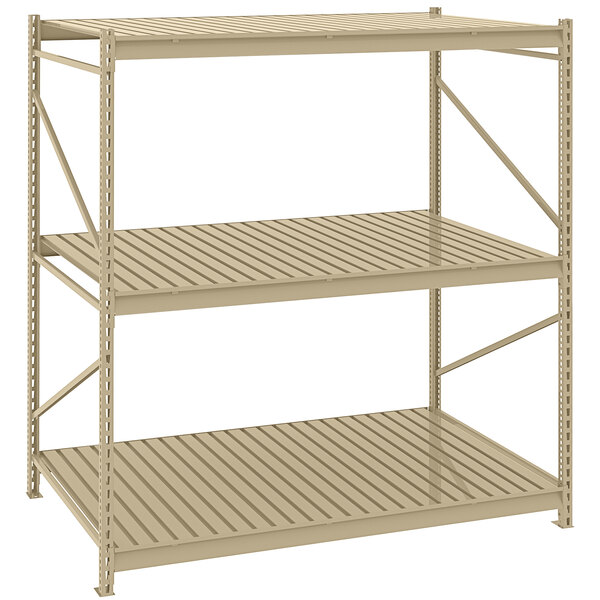 A Tennsco beige metal boltless shelving unit with corrugated decking.