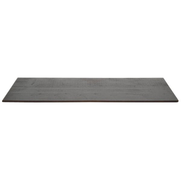 A black rectangular Front of the House Mahogany bamboo buffet board on a grey surface.