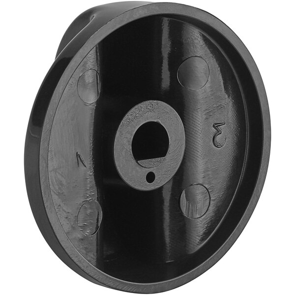 A black plastic Backyard Pro knob with a hole in the center.