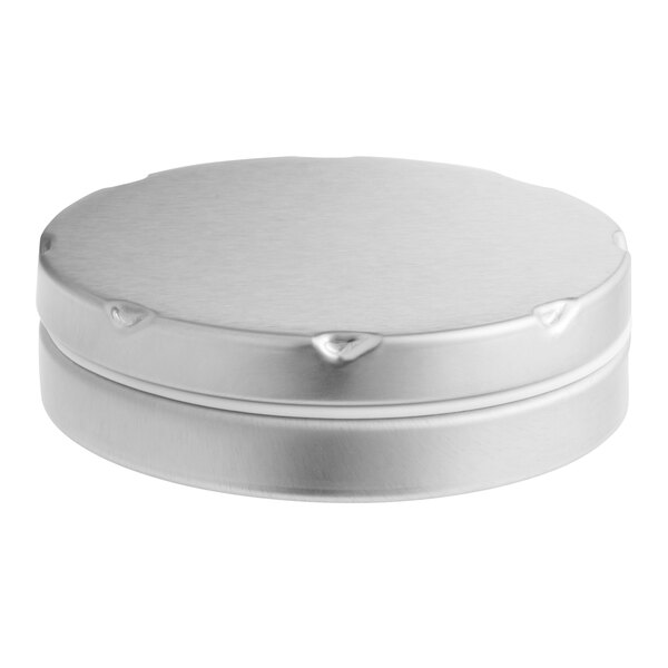 A round silver container with a notched lid.