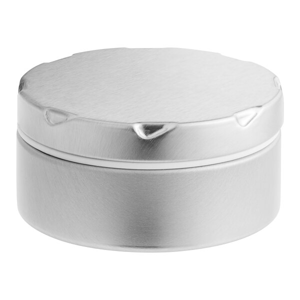 A round silver metal tin with a notched white lid.