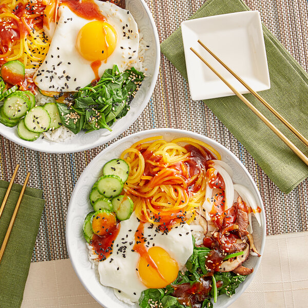 Bowl of Korean bibimbap with gochujang sauce