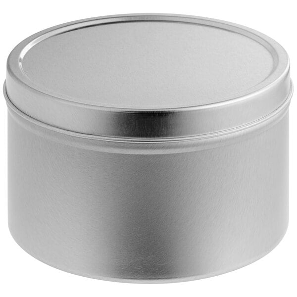 A round silver container with a lid.