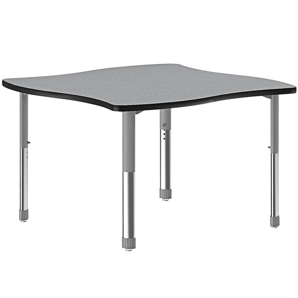 A rectangular gray Correll collaborative desk with gray legs and a black band.