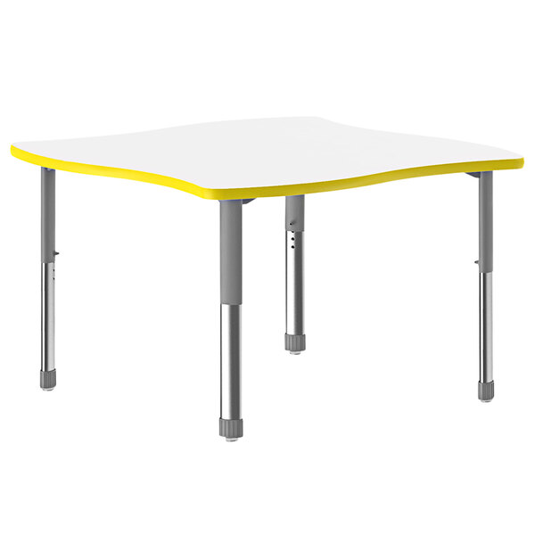 A white Correll table with yellow accents and metal legs.