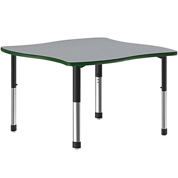 A grey rectangular Correll collaborative desk with a green band and black legs.