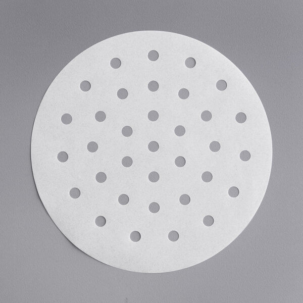 A white circular Choice patty paper with holes.