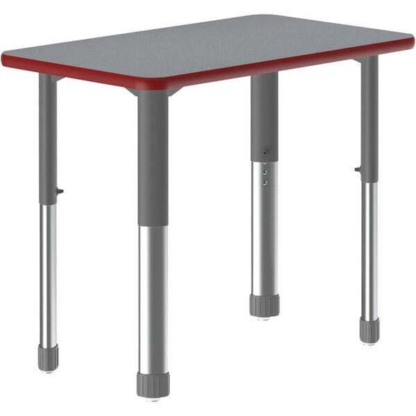 A grey rectangular Correll collaborative desk with a red edge and grey metal legs.