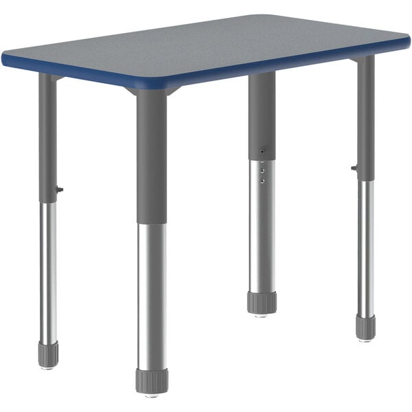 A grey rectangular Correll collaborative desk with grey legs and a blue edge on a table with legs.