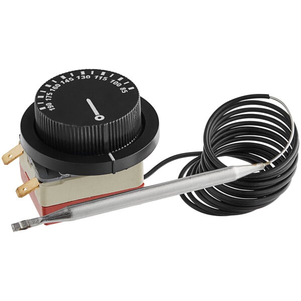 A black and white thermostat dial with a wire.