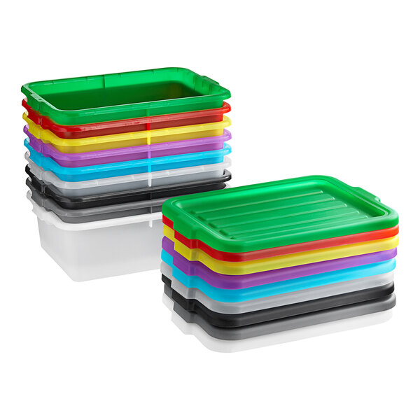 A stack of colorful plastic containers including green and red Vigor bus tubs.
