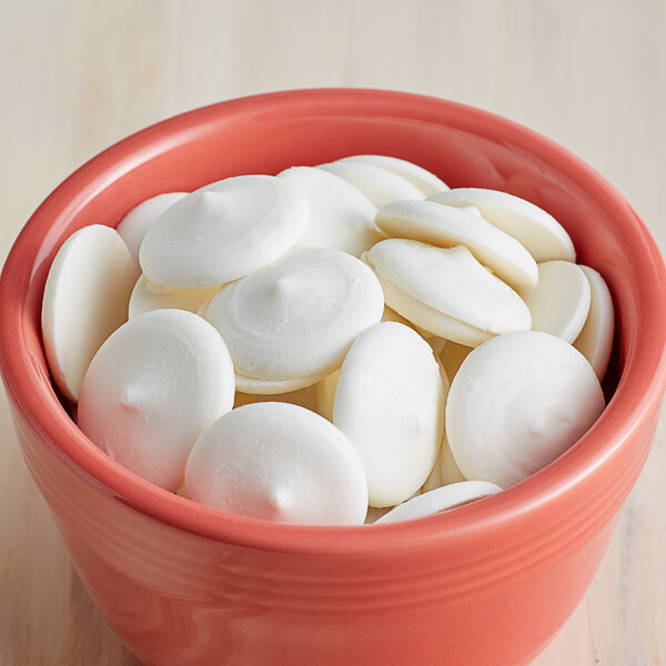 Alpine Bright White Vanilla Coating Wafers melting in a bowl.