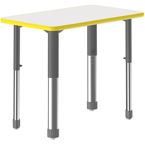 A white rectangular Correll desk with yellow edges and metal legs.