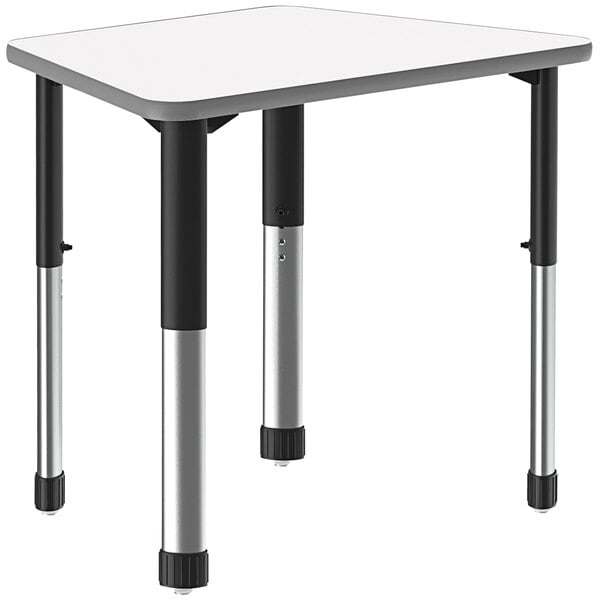 A white trapezoid table with black legs.