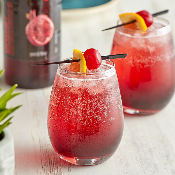 two grenadine cocktails in stemless glasses