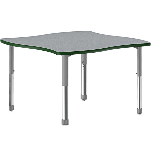 A grey Correll table with a green top and grey metal legs with a green band.