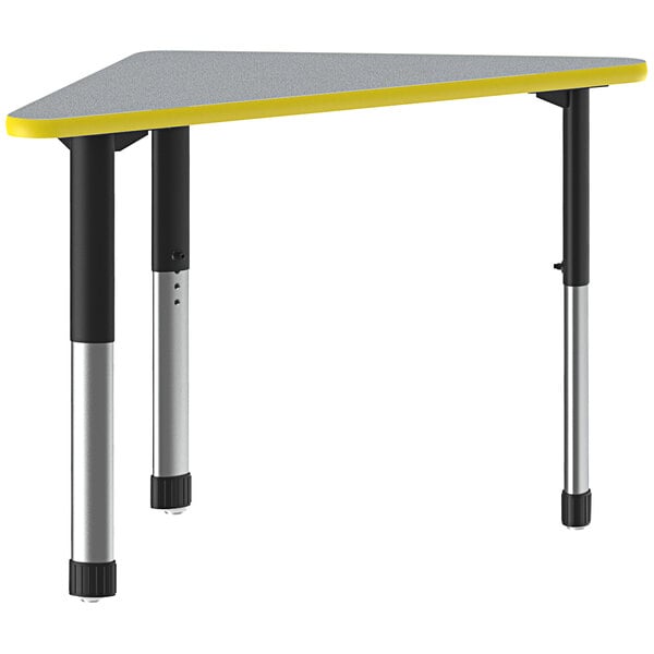 A triangular gray and yellow Correll collaborative desk with black legs.