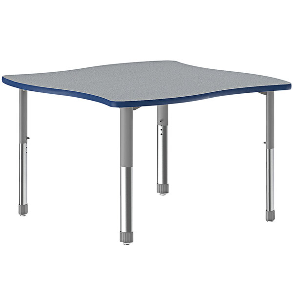 A rectangular Correll collaborative desk with gray top and gray legs.