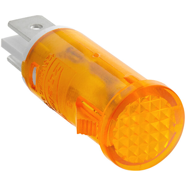 A close-up of a yellow indicator light with a white background.