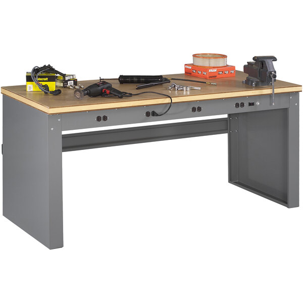 A Tennsco workbench with tools on it.