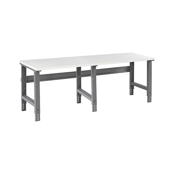 A white rectangular Tennsco workbench with metal legs.