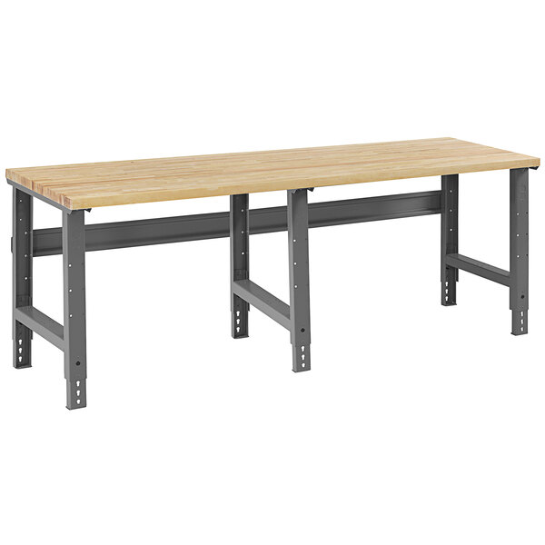 A Tennsco workbench with a hardwood top and steel legs.