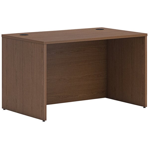 A brown HON laminate desk shell with a wooden top.