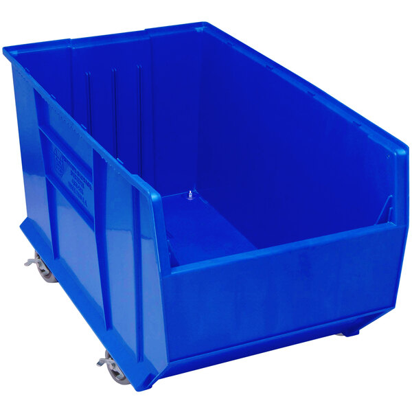 A Quantum blue plastic storage bin with wheels.