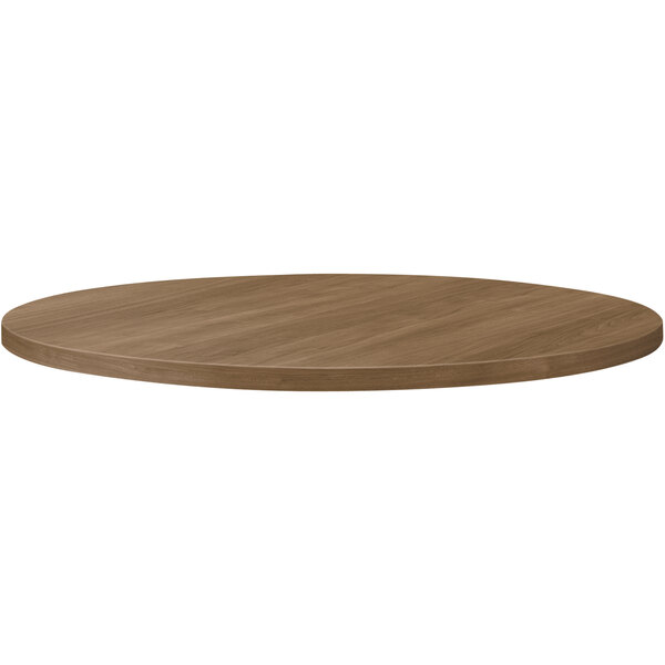 A brown circular HON laminate table top.