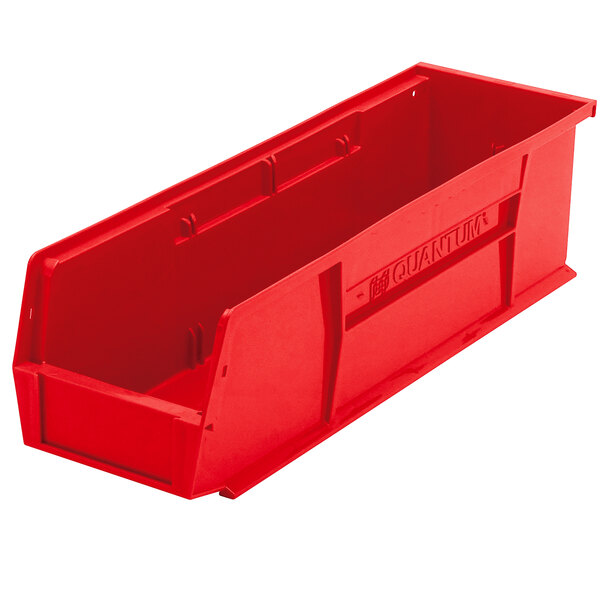 A red plastic Quantum hanging bin with a handle.