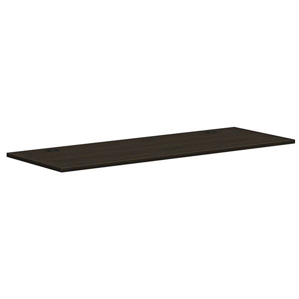 A dark wood rectangular worksurface.
