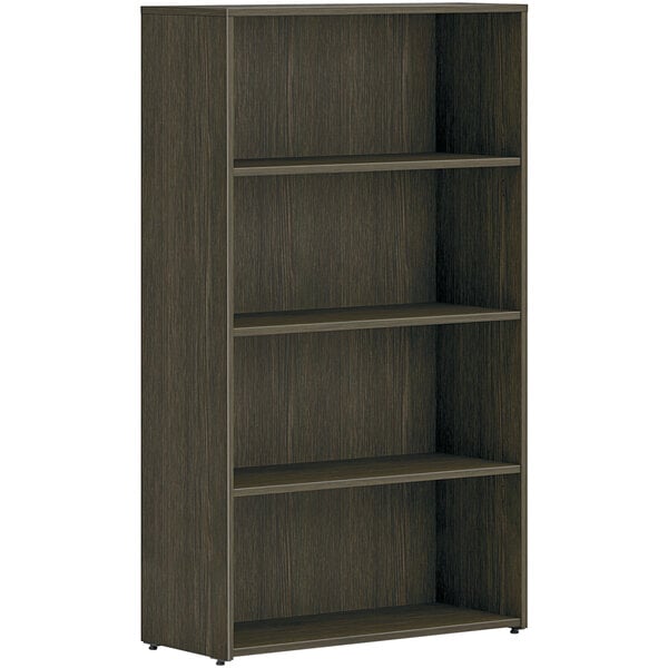 A brown HON bookcase with four shelves.