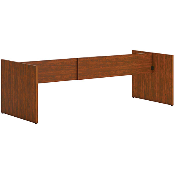 A russet cherry wood slab base for a conference table.