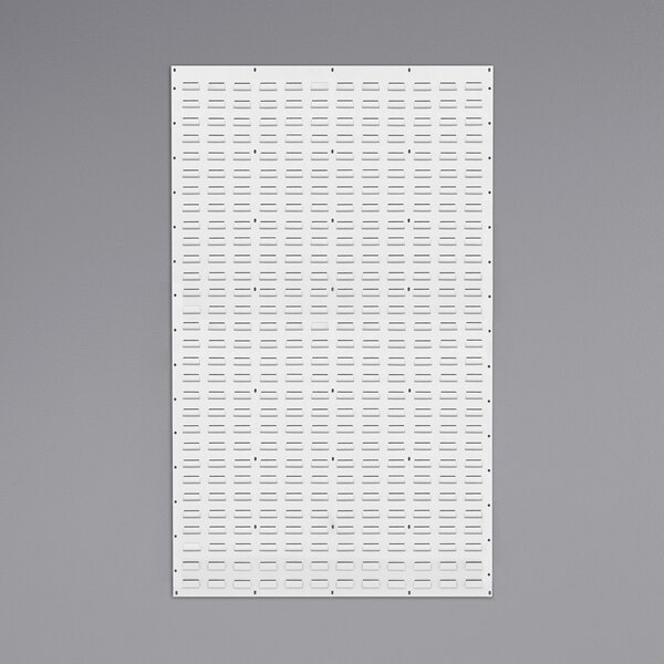A white rectangular steel panel with small holes in a grid pattern.