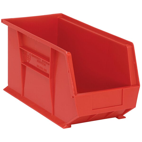 A red plastic Quantum hanging bin with a handle.