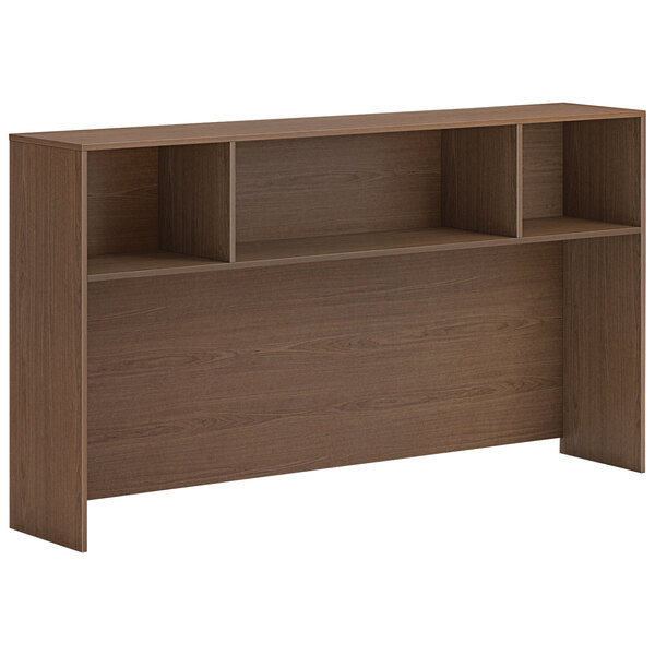 A brown HON open desk hutch with shelves.