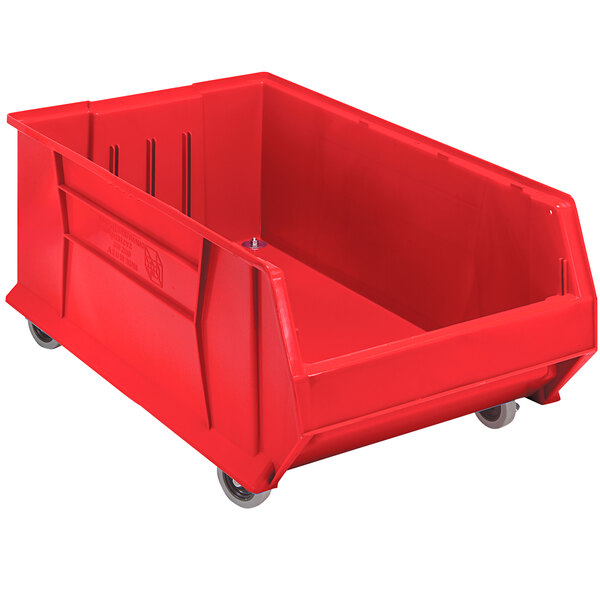 A Quantum red plastic storage bin with wheels.