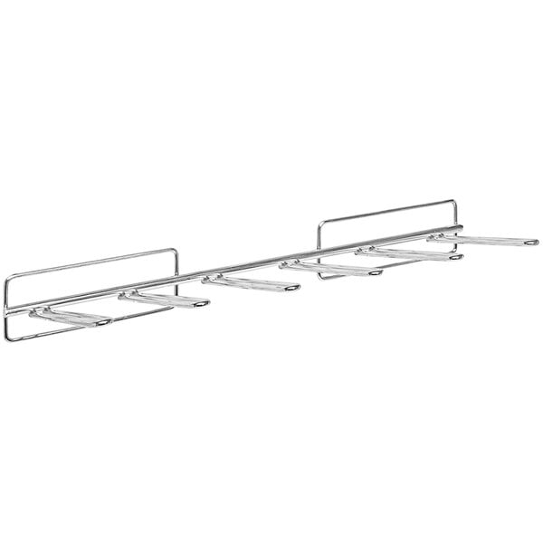 A Quantum metal rack with four hooks for holding tape reels on a louvered panel.