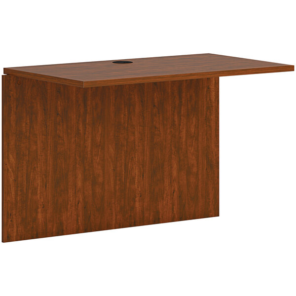 A wooden HON office bridge with a hole in the top.