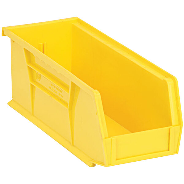 A yellow plastic Quantum hanging bin with a handle.