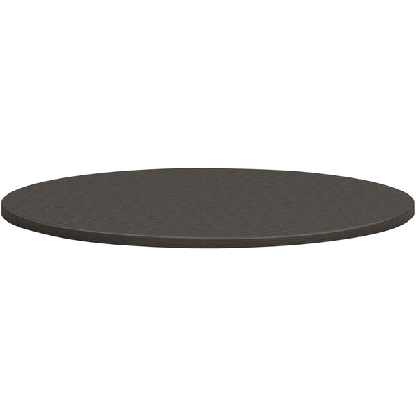 A black round HON conference table top.